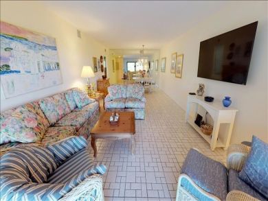 Just Steps to the Sandy Beach from this Two Bedroom Condo